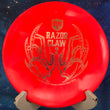 Load image into Gallery viewer, Pre-Owned Light Red Eagle McMahon Signature Razor Claw 2 (RC2) Vapor Discmania Tactic - 8/10 Condition - 176g - Inked.
