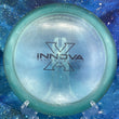 Load image into Gallery viewer, Pre-Owned Blue Penned X-Out Champion Innova Beast - Blue Translucent - 7.5/10 Condition - 174g - Inked on Bottom of Rim.
