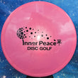 Load image into Gallery viewer, Pink Prodigy A2 in 500 plastic with Black Matte Inner Peace stamp - 173g.
