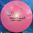 Load image into Gallery viewer, Pink Prodigy A2 in 500 plastic with Black Matte Inner Peace stamp - 173g.
