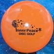 Load image into Gallery viewer, Orange Prodigy M3 in 400 plastic with Black Matte Inner Peace stamp - 180g.
