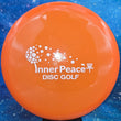 Load image into Gallery viewer, Orange Prodigy M3 in 400 plastic with White Matte Inner Peace stamp - 179g.
