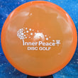 Load image into Gallery viewer, Orange Prodigy M3 in 400 plastic with White Matte Inner Peace stamp - 180g.
