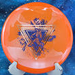 Load image into Gallery viewer, Top view of a Neon Orange Prodigy MX2 overstable midrange disc in 400 Glow plastic featuring a Gold Holographic and Navy Blue Matte 2-foil "Throwing Astro" Special Edition astronaut stamp.

